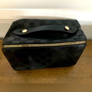 Two make up bags. Black and chocolate brown.